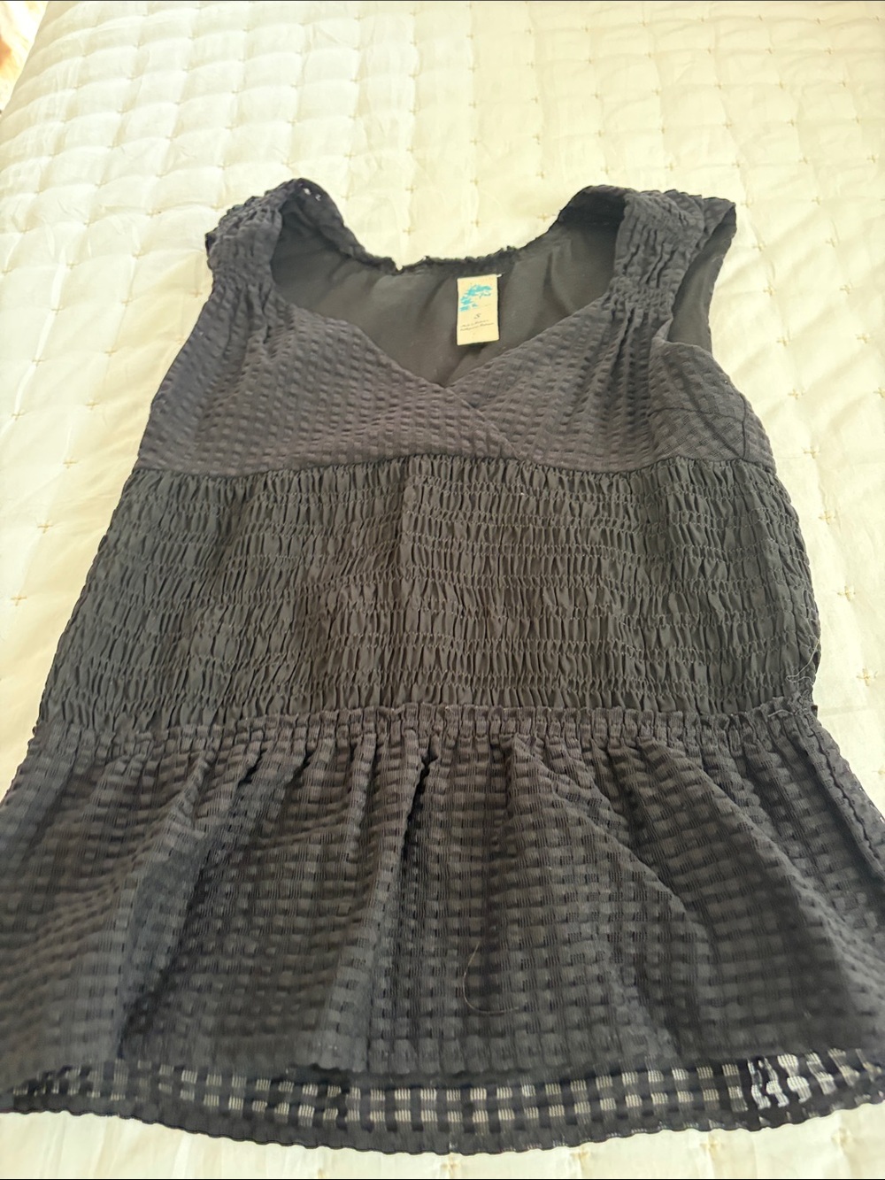 Anthropologie Black Sleeveless Smocked Peplum Top